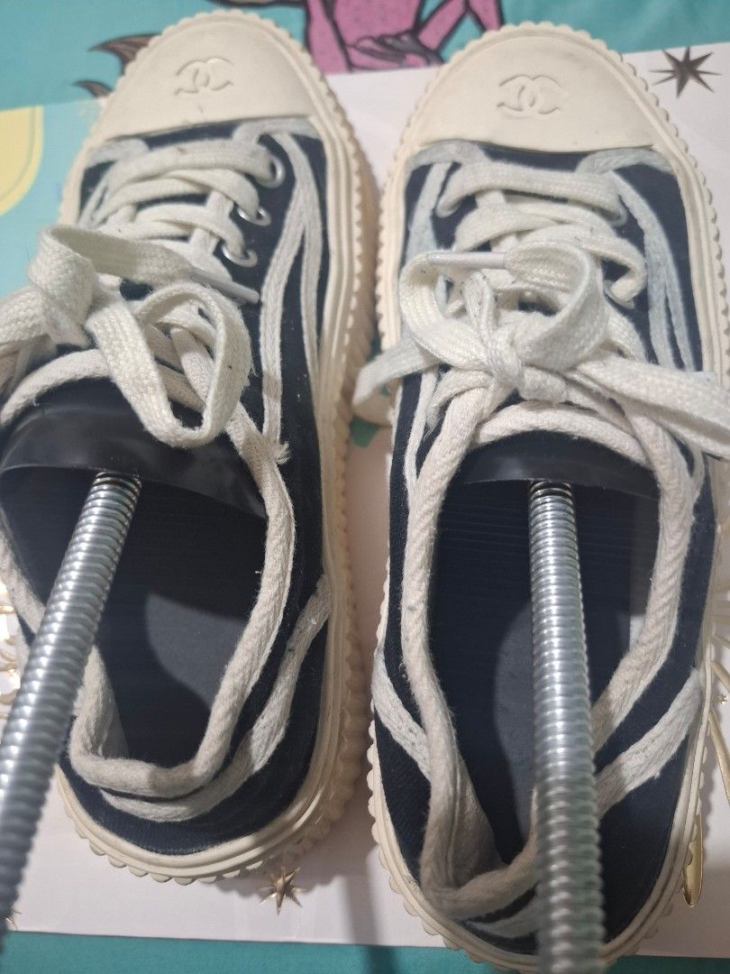 Chanel Canvas Sneakers (Category: Sneakers) located in Marikina City. Submitted by bags21.ph (Listing ID 1464484418, Image 3). Description: - Classic Chanel canvas sneakers - Navy blue with white laces and soles - Iconic Chanel logo on toe cap - "Chanel" branding on side tag - NO INSOLE PADS - "Chanel" embossed on rubber sole - Ideal for everyday wear.
