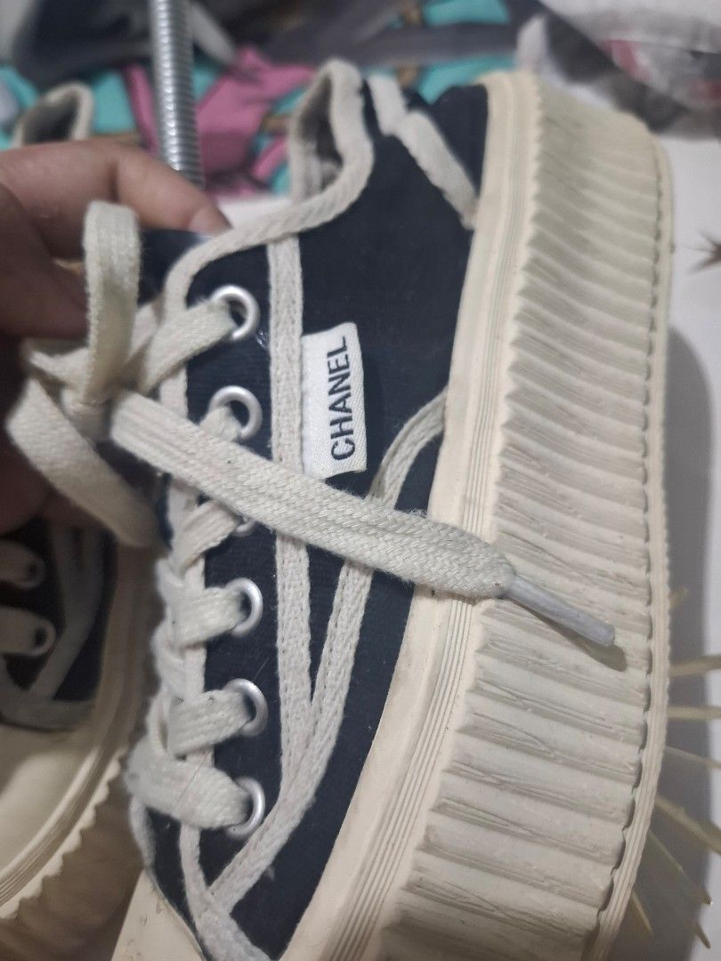 Chanel Canvas Sneakers (Category: Sneakers) located in Marikina City. Submitted by bags21.ph (Listing ID 1464484418, Image 2). Description: - Classic Chanel canvas sneakers - Navy blue with white laces and soles - Iconic Chanel logo on toe cap - "Chanel" branding on side tag - NO INSOLE PADS - "Chanel" embossed on rubber sole - Ideal for everyday wear.