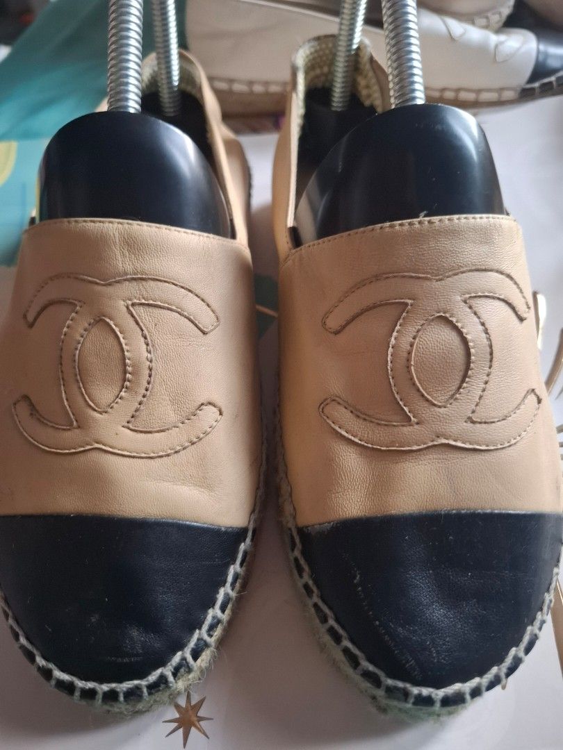 Chanel Espadrilles Beige and Black Leather (Category: Flats & Sandals) located in Marikina City. Submitted by bags21.ph (Listing ID 1464438254, Image 1). Description: - Classic Chanel espadrilles - Beige leather straps with black toe caps - Jute sole detail - Stylish and versatile for any occasion - Easy slip-on design - Perfect for everyday wear.