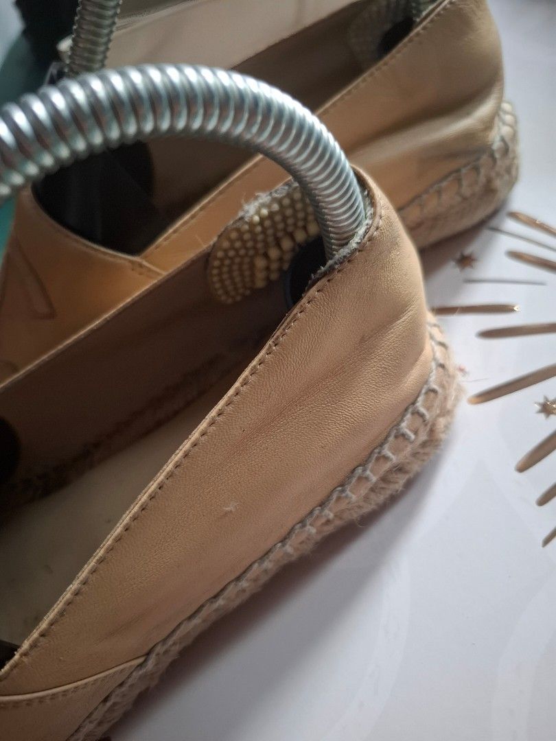 Chanel Espadrilles Beige and Black Leather (Category: Flats & Sandals) located in Marikina City. Submitted by bags21.ph (Listing ID 1464438254, Image 2). Description: - Classic Chanel espadrilles - Beige leather straps with black toe caps - Jute sole detail - Stylish and versatile for any occasion - Easy slip-on design - Perfect for everyday wear.