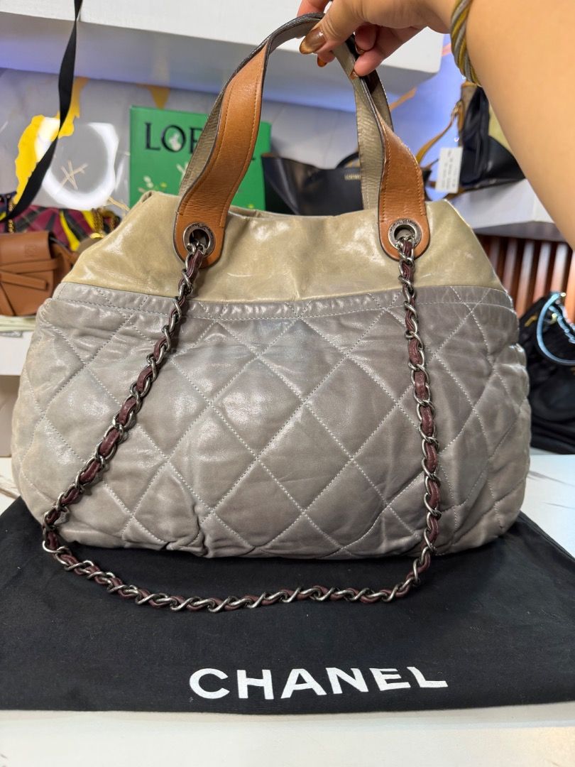 Chanel Quilted Leather Shoulder Bag (Category: Luxury Bags & Wallets) located in Caloocan City. Submitted by piamariemo11606 (Listing ID 1464513245, Image 2). Description: - Authentic Chanel handbag - Quilted grey and beige leather exterior - Brown leather top handles - Brown leather accent chain straps - Burgundy fabric interior lining - Made in Italy - Serial number visible in photos.