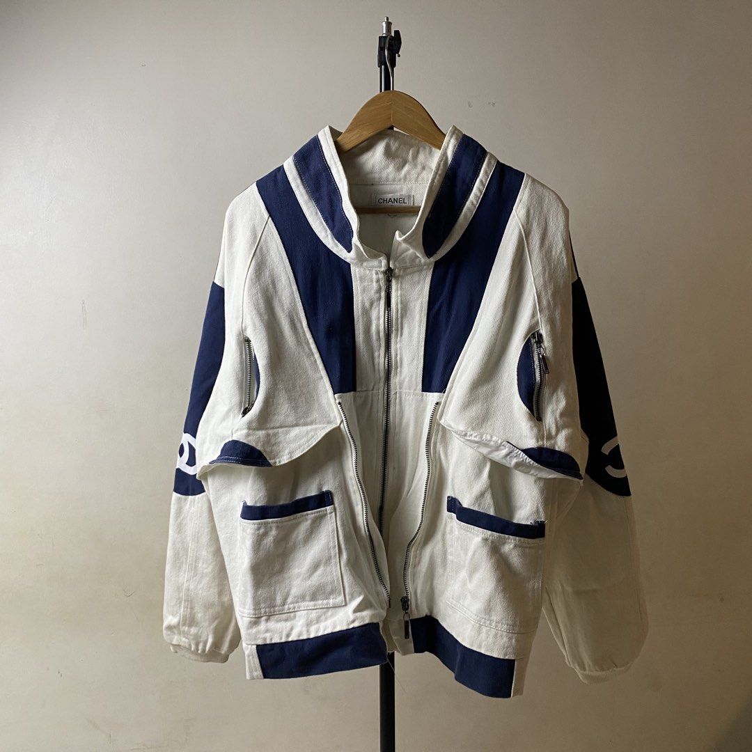 Chanel White Blue Colorblock Zip Up Jacket (Category: Luxury Apparel) located in Davao. Submitted by y2c0re (Listing ID 1464407669, Image 1). Description: Chanel Canvas Jacket Fits Medium/Large Boxy fittings Height Model 5’3 ft - 23 width if outer zipper is closed - 26 width if outer zipper is open - 26 length Excellent condition Flaw/s: dirt only needs wash 9.5/10 - Chanel jacket - Stylish white and navy blue colorblock design - Convenient zip-u