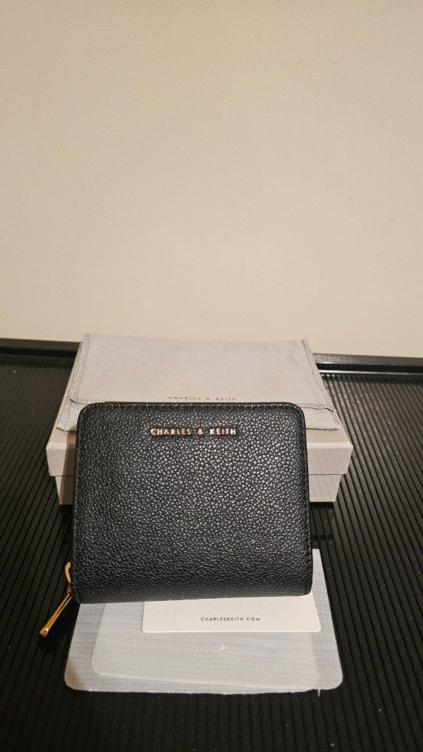 Charles & Keith Black Textured Zip Wallet (Category: Wallets & Card holders) located in Cebu City. Submitted by sherosales (Listing ID 1464474977, Image 2). Description: - Brand: Charles & Keith - Color: Black - Material: Textured - Closure: Zip around - Interior: Card slots, coin pouch - Includes: Dust bag and box.
