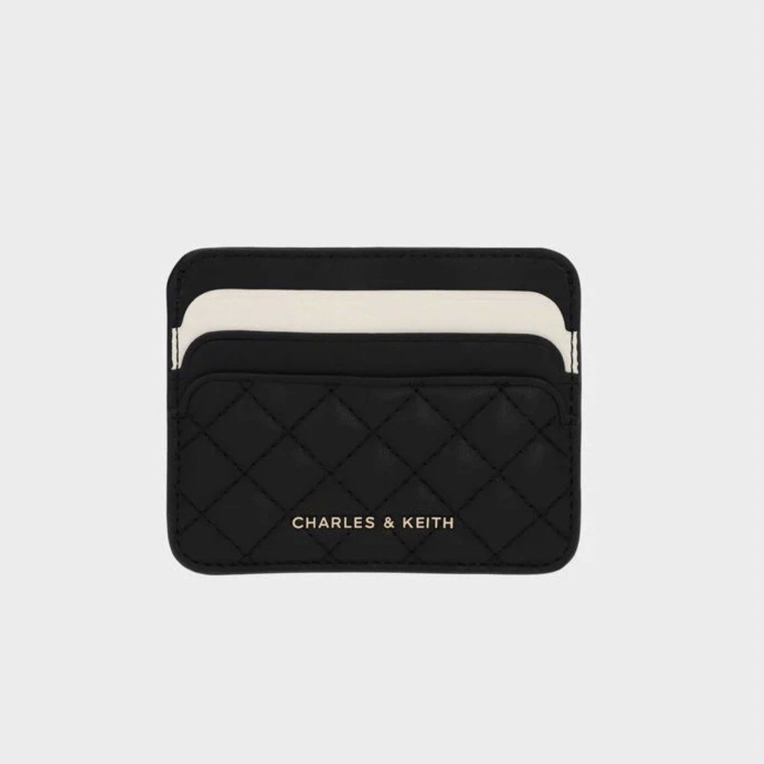 CHARLES & KEITH Cleo Two-Tone Quilted Card Holder (Category: Wallets & Card holders) located in Santa Rosa. Submitted by sha.mnl (Listing ID 1464422530, Image 1). Description: — Inclusions: Card Holder, Dust Bag & Box — Color: Midnight Black — Size: XXS — 6 Card Slots w/ Middle Compartment.