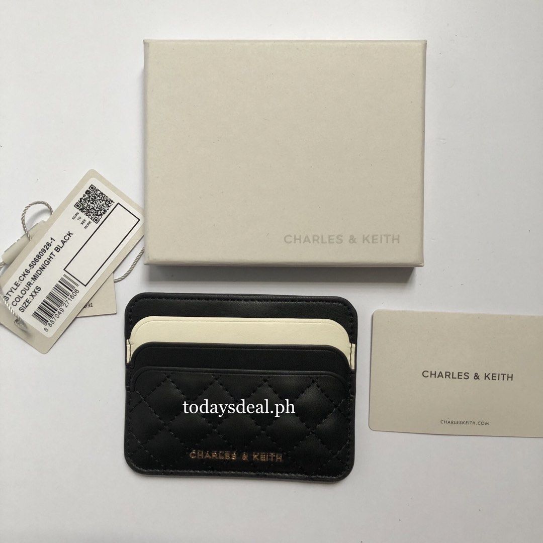 CHARLES & KEITH Cleo Two-Tone Quilted Card Holder (Category: Wallets & Card holders) located in Santa Rosa. Submitted by sha.mnl (Listing ID 1464422530, Image 3). Description: — Inclusions: Card Holder, Dust Bag & Box — Color: Midnight Black — Size: XXS — 6 Card Slots w/ Middle Compartment.