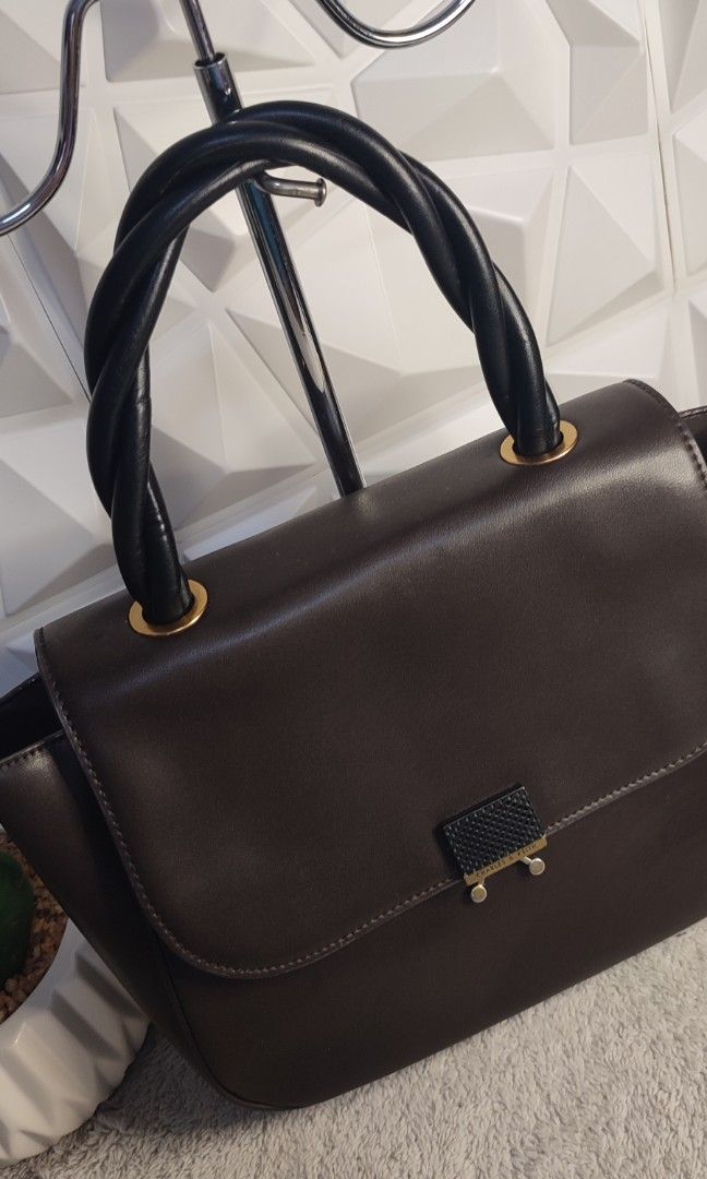 Charles and Keith Twisty Top Handle Bag (Category: Shoulder Bags) located in Pasig City. Submitted by xcess_baggage (Listing ID 1464402907, Image 3). Description: .