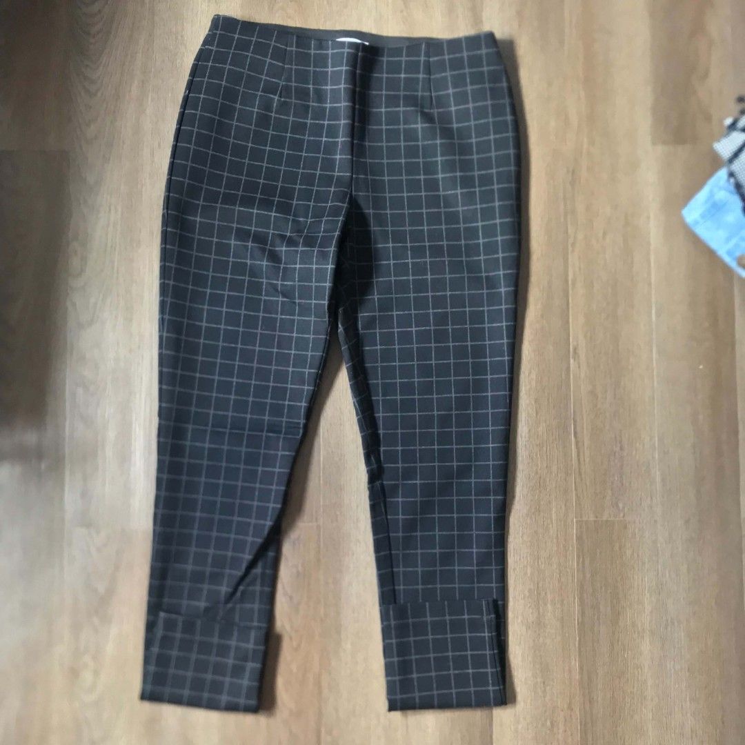 Checkered Cropped Pants (Category: Jeans) located in Manila. Submitted by joshbelgic17602 (Listing ID 1464436899, Image 1). Description: - Dark grey pants with a subtle checkered pattern. - Cropped length for a modern look. - Features a slight slit at the hem. - Comfortable and versatile for any occasion. - Easily pairs with various tops and shoes..