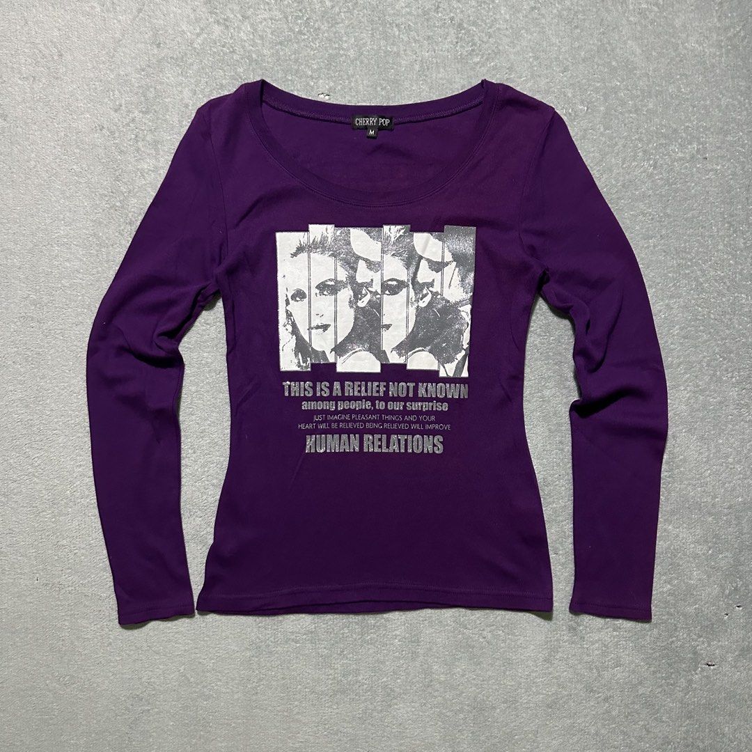 Cherry Pop Purple Graphic Long Sleeve Tee Size M (Category: Longsleeves) located in Villaverde. Submitted by bakatzy_secondhand_garments (Listing ID 1464436818, Image 1). Description: - Brand: Cherry Pop - Color: Purple - Sleeves: Long-sleeved - Size: M - Front Graphic: Text reads 'THIS IS A RELIEF NOT KNOWN among people, to our surprise JUST IMAGINE PLEASANT THINGS AND YOUR HEART WILL BE RELIEVED BEING RELIEVED WILL IMPROVE HUMAN RELATIONS' - Ba