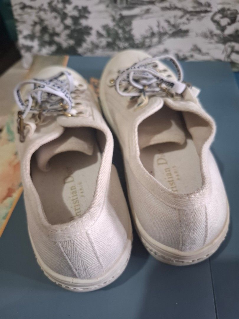 Christian Dior Canvas Sneakers (Category: Sneakers) located in Marikina City. Submitted by bags21.ph (Listing ID 1464372626, Image 3). Description: - Authentic Christian Dior sneakers - Features iconic Dior logo ribbon laces - Available in black and white canvas - Classic low-top style - Ideal for casual wear - Please check photos for detailed condition.
