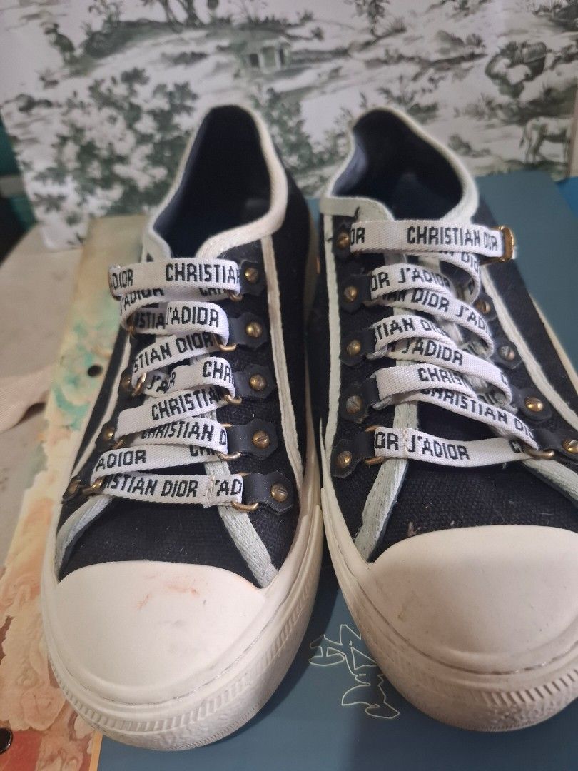 Christian Dior Canvas Sneakers (Category: Sneakers) located in Marikina City. Submitted by bags21.ph (Listing ID 1464372626, Image 1). Description: - Authentic Christian Dior sneakers - Features iconic Dior logo ribbon laces - Available in black and white canvas - Classic low-top style - Ideal for casual wear - Please check photos for detailed condition.