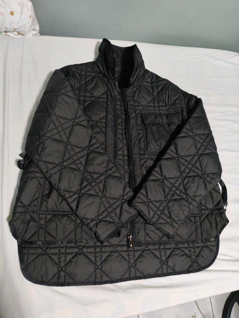 Christian Dior Quilted Jacket (Category: Coats, Jackets and Outerwear) located in Lucena. Submitted by cha_riz010726 (Listing ID 1464549337, Image 2). Description: - Black quilted jacket - Features iconic CD logo and bee embroidery - Zip-up front closure - Multiple functional pockets - Adjustable straps on the sides for a customized fit - Classic Dior-inspired design.