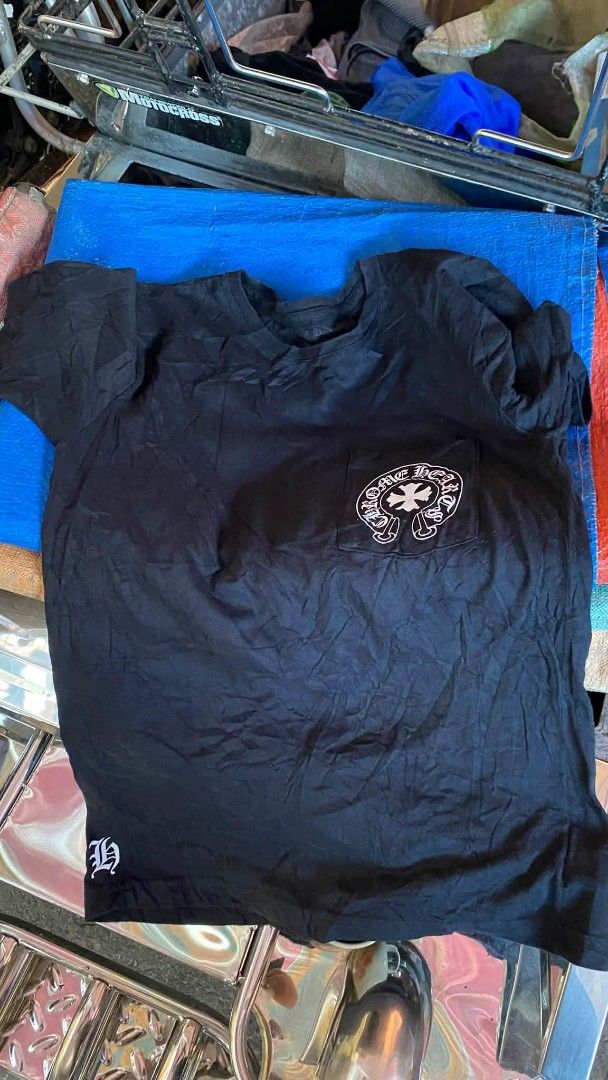 Chrome Hearts T-Shirt Size Small (Category: Tshirts & Polo Shirts ) located in Manila. Submitted by bertingggg (Listing ID 1464365726, Image 1). Description: -Vintage9, Authentic Chrome Hearts Black T-Shirt - Size: Small - Classic Chrome Hearts logo on front pocket - Large graphic print on the back - Made in USA - Please check photos for detailed condition.