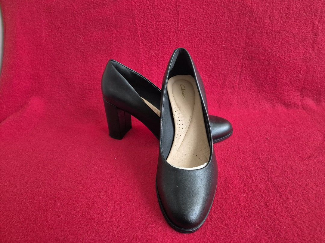 Clarks Pumps size 39 (Category: Heels) located in Makati City. Submitted by maydeleo1 (Listing ID 1464384953, Image 1). Description: Clarks Freva85 Court Black Leather Pumps with Box (Size 39) Price: ₱3,000 [Worn Once] Description: Selling these classic Clarks Freva85 Court Pumps in premium black leather. Worn only once for a quick indoor event—they are in pristine, like-new condition! Perfect and extremely comfortable for office wear, business m
