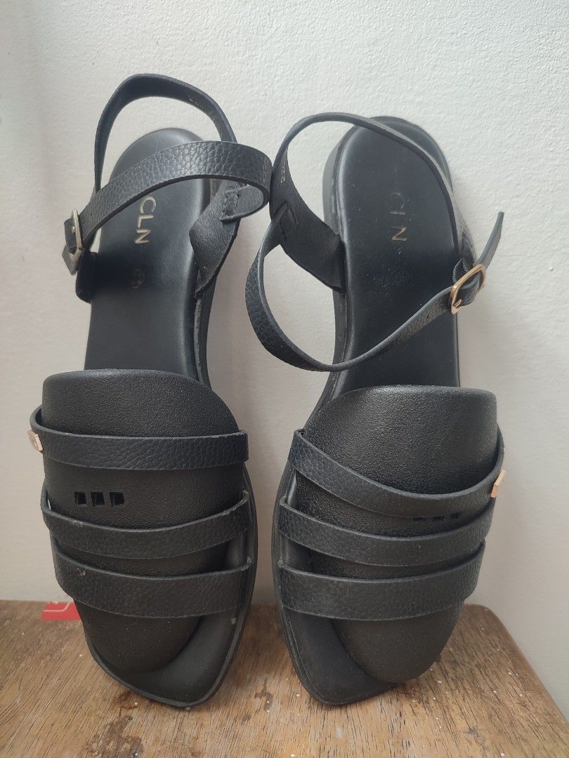 CLN Black Strappy Flat Sandals Size 37 (Category: Flats & Sandals) located in Manila. Submitted by messiscar290860 (Listing ID 1464394159, Image 2). Description: - Brand: CLN - Color: Black - Size: 37 - Design: Strappy with buckle ankle strap - Features: CLN logo and grip on soles - Comfort: Suitable for everyday wear and casual outings.