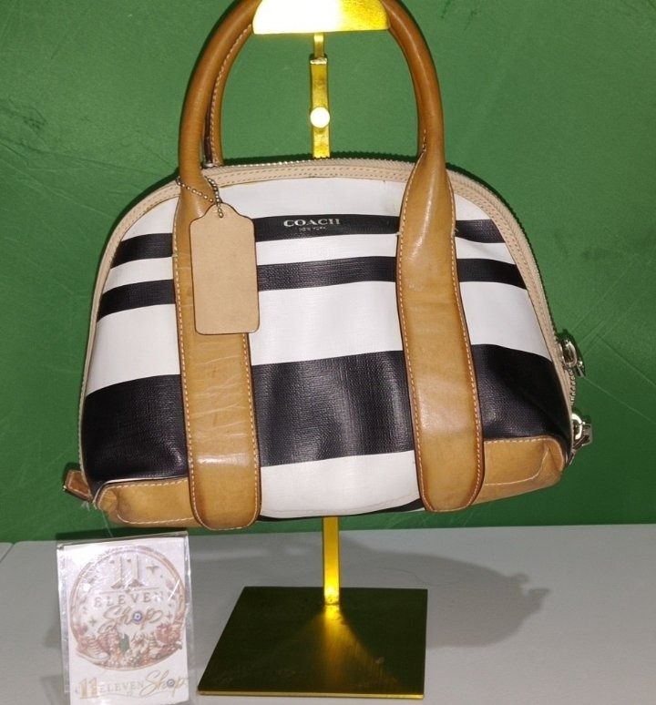 Authentic Coach 2 Way Bag (Category: Luxury Bags & Wallets) located in Caloocan City. Submitted by 11eleven.shop (Listing ID 1464528627, Image 1). Description: -Striped Coated Canvas Tan Leather - Elegant tan leather trim and handles. - Released old stock from Philippine Factory (essentially brand new but kept as old stock).
