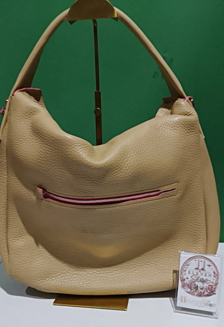 Authentic Coach Bleecker Pebbled Leather Sullivan Hobo (Category: Luxury Bags & Wallets) located in Caloocan City. Submitted by 11eleven.shop (Listing ID 1464522864, Image 3). Description: - Authentic Coach tan pebble leather hobo bag - Eye-catching bright pink interior lining and zipper trim - 2-way - Vintage Brand New (old stock released from PH factory) - Spacious main compartment for all your essentials - Very clean interior with leather cree