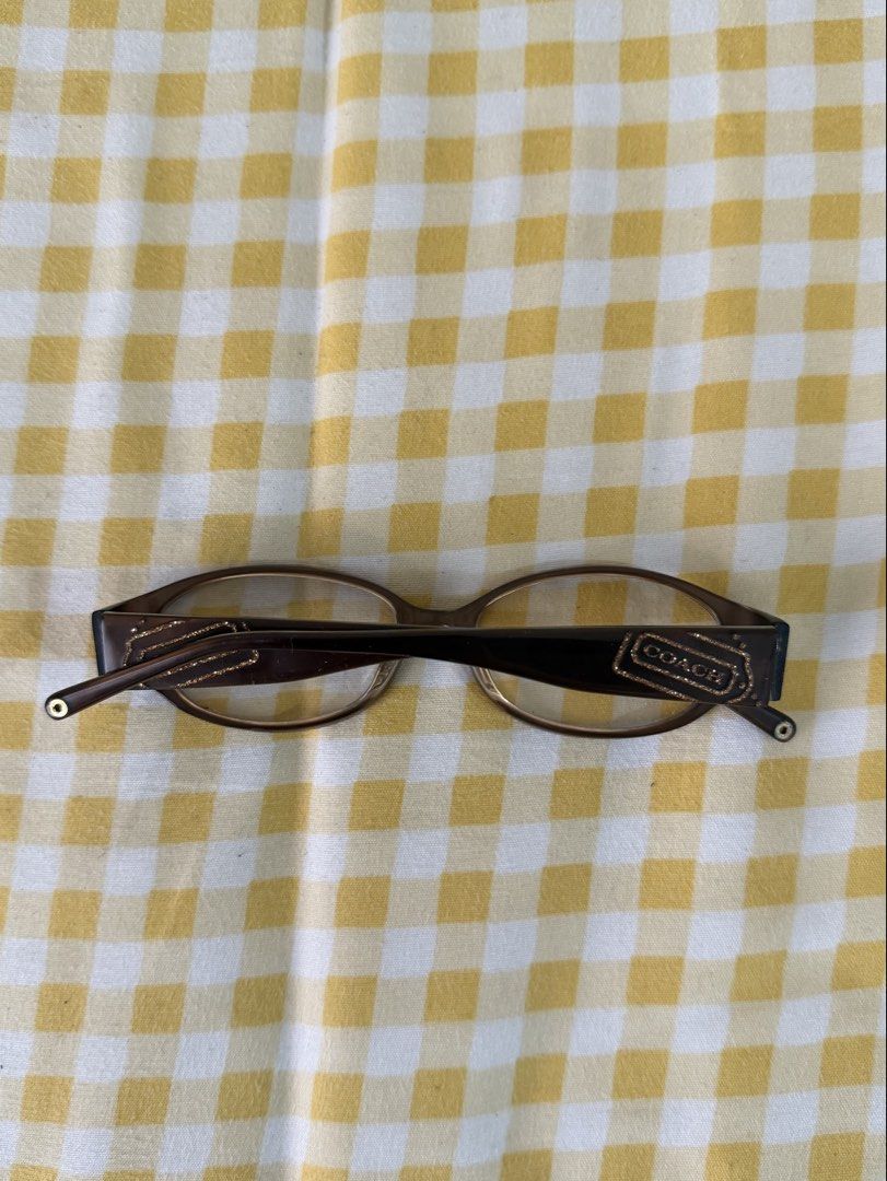 Coach Brown Eyewear (Category: Sunglasses & Eyewear) located in Manila. Submitted by znda.e (Listing ID 1464410096, Image 2). Description: - Authentic brown Coach eyeglasses frame - Coach logo on the side - Note: May grade yung lenses - I can give you a case with it - Lalamove/Jnt (Pasay) .