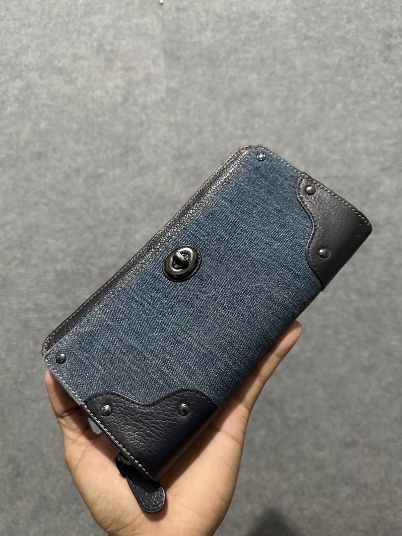 Coach Denim and Leather Zip Around Wallet (Category: Wallets & Card holders) located in Villasis. Submitted by justinramosonfb (Listing ID 1464508745, Image 1). Description: - Coach wallet - Denim and dark leather accents - Secure turn-lock closure - Ample space for cards and cash - Perfect for everyday use - Shows some signs of wear, but plenty of life left.