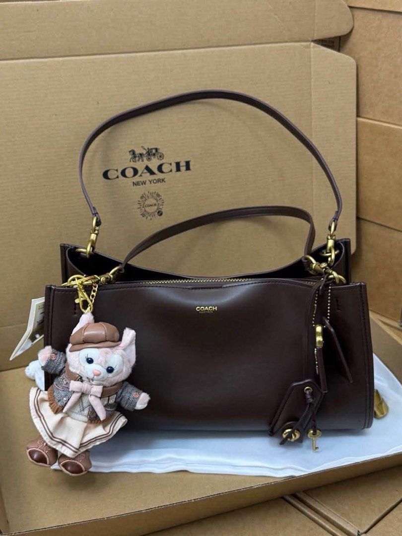 Coach Leather Shoulder Bag - Dark Brown & Black (Category: Luxury Bags & Wallets) located in Manila. Submitted by liahsells (Listing ID 1464433540, Image 1). Description: - Two authentic Coach leather shoulder bags - Available colors: Dark Brown and Black - Features classic Coach logo and hardware - Includes original dust bags and boxes - Versatile for everyday wear or special events.