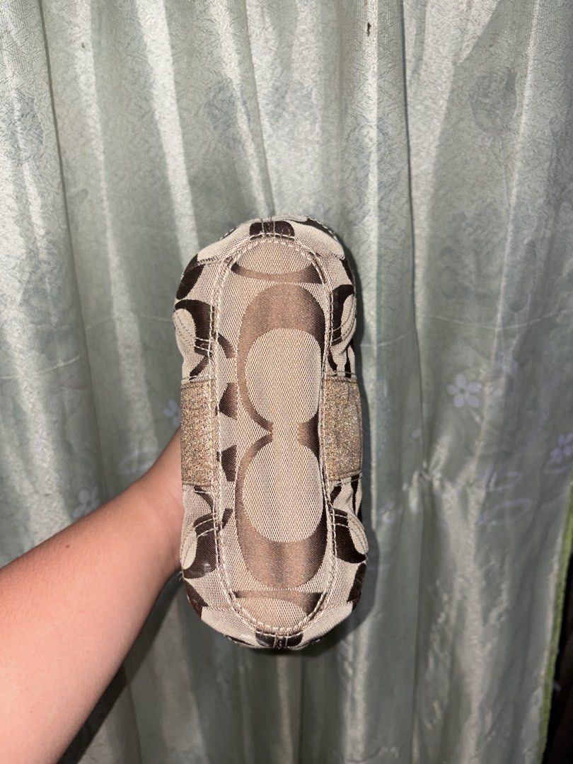 Coach Mini Shoulder Bag (Category: Shoulder Bags) located in Minalin. Submitted by warmmountain.21c981 (Listing ID 1464490389, Image 2). Description: Good condition and no rubs! • Clean and well-kept • Classic Coach monogram design • Brown/neutral color , the flaw po is just nag f fade yung metallic nya as u can see on the pic, but super okay since match sya sa color ng bag. RFS: Decluttering / no longer using it PM me if inch!.