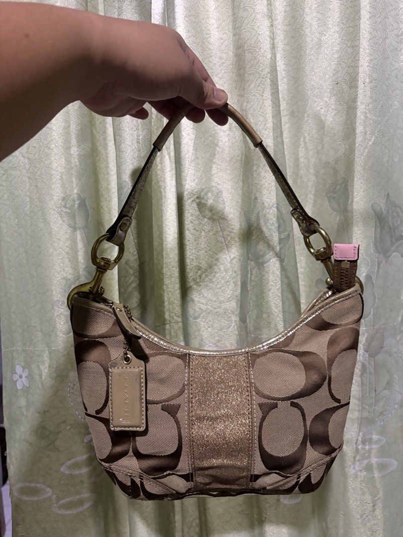 Coach Mini Shoulder Bag (Category: Shoulder Bags) located in Minalin. Submitted by warmmountain.21c981 (Listing ID 1464490389, Image 1). Description: Good condition and no rubs! • Clean and well-kept • Classic Coach monogram design • Brown/neutral color , the flaw po is just nag f fade yung metallic nya as u can see on the pic, but super okay since match sya sa color ng bag. RFS: Decluttering / no longer using it PM me if inch!.