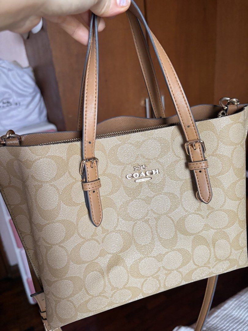 Coach Mollie (Category: Cross-body Bags) located in Pateros City. Submitted by diazmine (Listing ID 1464567409, Image 3). Description: 🎯 Read caption carefully ‼️ Selling because the hang tag was lost. You will see in the last photo uploaded how’s the hang tag looks like when the bag was newly purchased. It’s 💯 original, and still has its complete inclusions (paper bag, dust bag and purchase cards. .