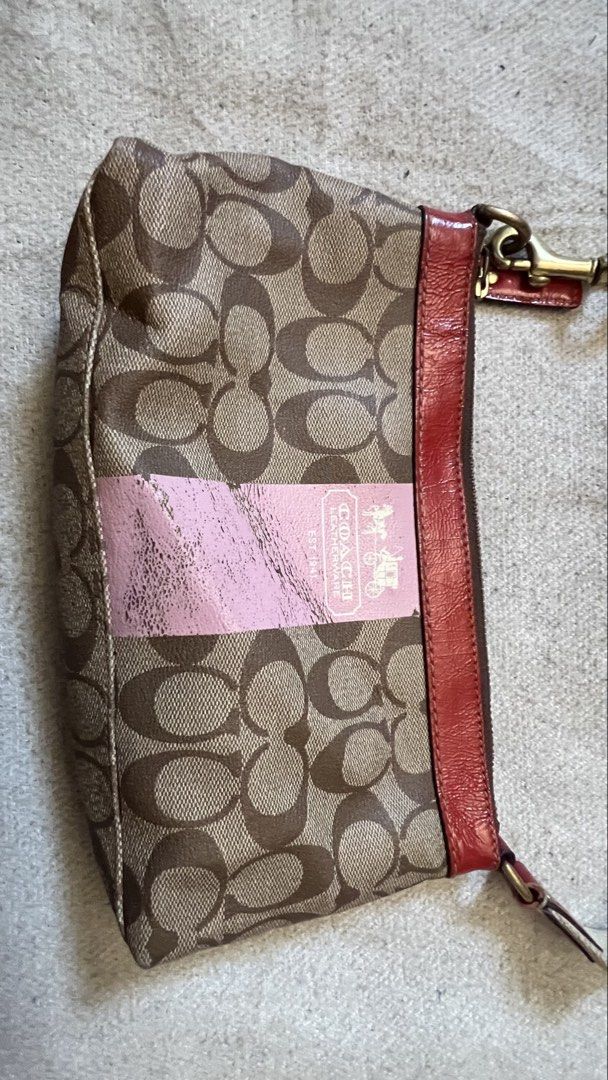 Coach Monogram Canvas & Leather Trim Shoulder Bag (Category: Luxury Bags & Wallets) located in Cagayan de Oro. Submitted by nelsondel21723 (Listing ID 1464387683, Image 2). Description: - Classic Coach monogram canvas shoulder bag - Features stylish red leather trim - Eye-catching pink stripe detail - Bright pink fabric interior lining - Secure zipper closure for your essentials - Ideal for everyday use - Approximate dimensions: 10 inches wide x 