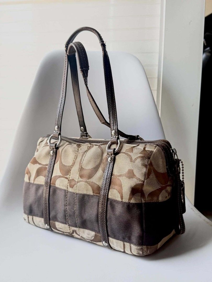 Coach Monogram Canvas & Leather Trimmed Satchel Bag (Category: Luxury Bags & Wallets) located in Lucena. Submitted by pureg0od (Listing ID 1464398257, Image 2). Description: - Classic Coach monogram satchel - Color: Brown and tan canvas with dark brown leather trim - Closure: Zipper top - Hardware: Silver details - Interior: Spacious, great for essentials - Style: Perfect everyday bag.