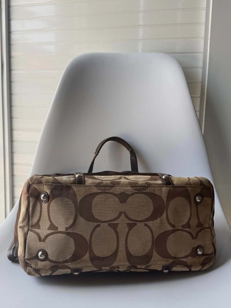 Coach Monogram Canvas & Leather Trimmed Satchel Bag (Category: Luxury Bags & Wallets) located in Lucena. Submitted by pureg0od (Listing ID 1464398257, Image 3). Description: - Classic Coach monogram satchel - Color: Brown and tan canvas with dark brown leather trim - Closure: Zipper top - Hardware: Silver details - Interior: Spacious, great for essentials - Style: Perfect everyday bag.