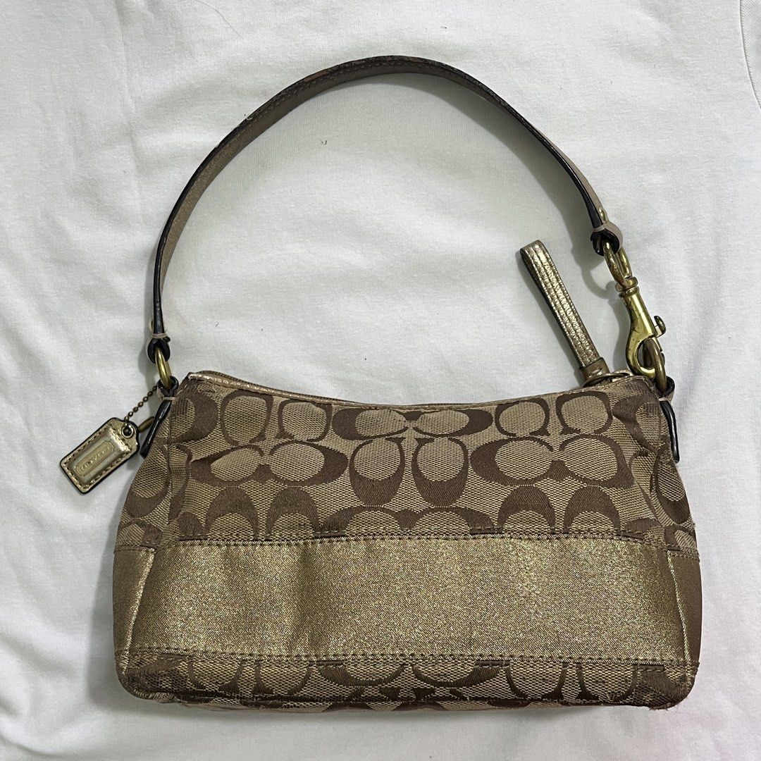 Coach Monogram Canvas & Metallic Gold Shoulder Bag (Category: Luxury Bags & Wallets) located in Manila. Submitted by xodaize (Listing ID 1464362204, Image 1). Description: - Classic Coach monogram canvas shoulder bag - Metallic gold accent strip across the front - Leather strap with gold-tone hardware - Signature Coach hangtag included Issue - signs of wear The condition of the bag is also disclosed on the pictures. .