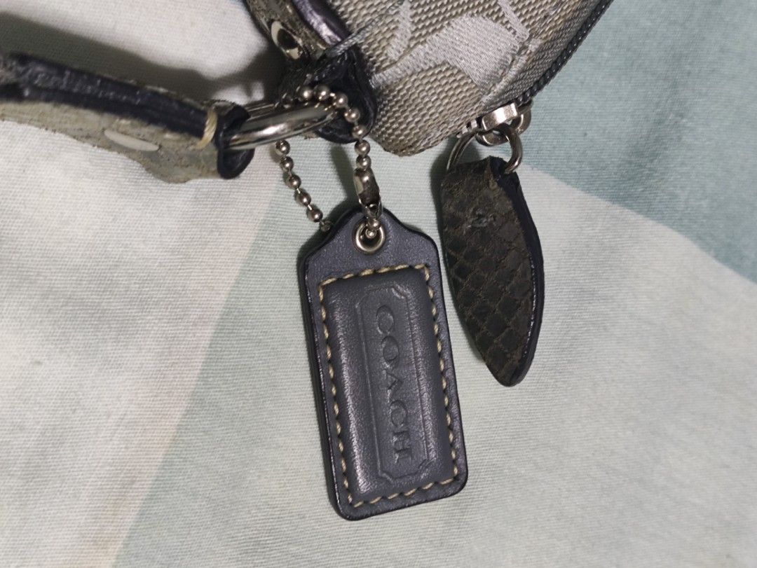 Coach Monogram Canvas Crossbody Bag Grey (Category: Luxury Bags & Wallets) located in Lucena. Submitted by cha_riz010726 (Listing ID 1464549095, Image 3). Description: - Grey Coach monogram canvas crossbody bag - Front pocket with secure turn-lock closure - Main compartment with zip-top opening - Adjustable shoulder strap for comfort - Includes authentic Coach hang tags - Compact and ideal for everyday use.