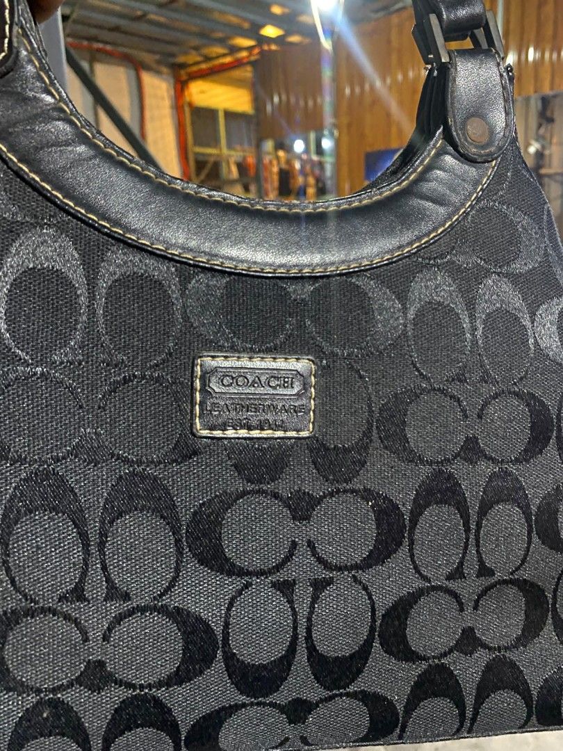 Coach Monogram Canvas Leather Trim Shoulder Bag (Category: Luxury Bags & Wallets) located in Bacolod City. Submitted by carlo1019 (Listing ID 1464500101, Image 2). Description: - Classic Coach monogram shoulder bag - Black canvas with leather trim and handles - Interior: zip pocket and slip pockets - Authenticity tag with serial number inside - Ideal for everyday use.