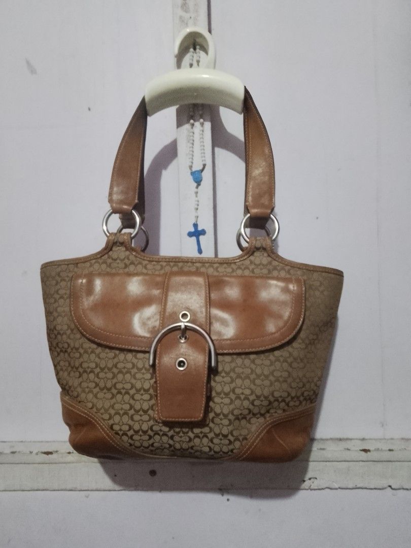 Coach Monogram Canvas Leather Trim Shoulder Bag (Category: Luxury Bags & Wallets) located in Quezon City. Submitted by theoneshop1 (Listing ID 1464503262, Image 1). Description: - Classic Coach shoulder bag - Tan and brown monogram canvas with leather trim - Buckle closure on front flap - Silver hardware details - Interior zip pocket - Serial number: N° G04Q-7081 - Great everyday bag.