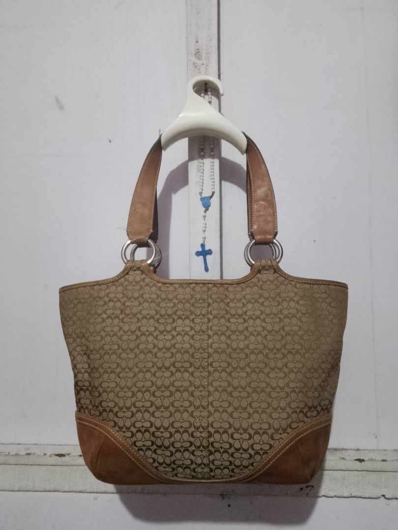 Coach Monogram Canvas Leather Trim Shoulder Bag (Category: Luxury Bags & Wallets) located in Quezon City. Submitted by theoneshop1 (Listing ID 1464503262, Image 2). Description: - Classic Coach shoulder bag - Tan and brown monogram canvas with leather trim - Buckle closure on front flap - Silver hardware details - Interior zip pocket - Serial number: N° G04Q-7081 - Great everyday bag.