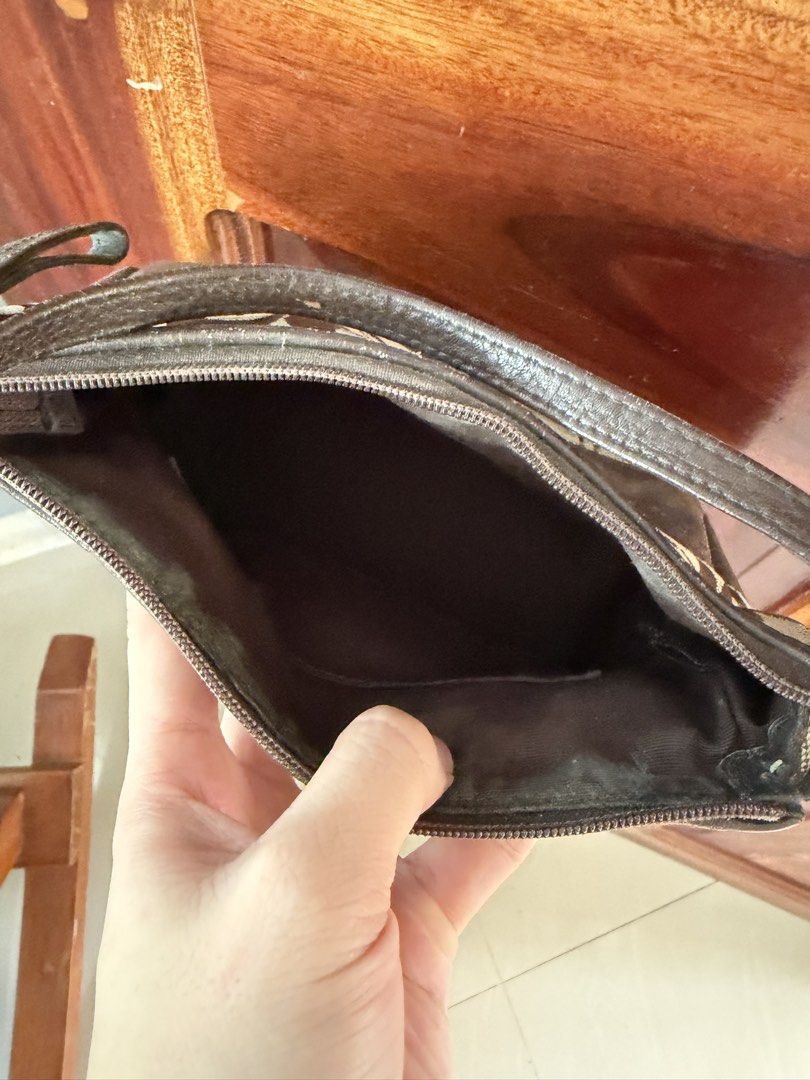 Coach Monogram Shoulder Bag (Category: Luxury Bags & Wallets) located in Caloocan City. Submitted by tintin.wolf (Listing ID 1464381424, Image 2). Description: Classic Coach monogram shoulder bag in brown and tan canvas with leather trim. Zipper closure, interior pocket. Compact size, perfect for essentials..