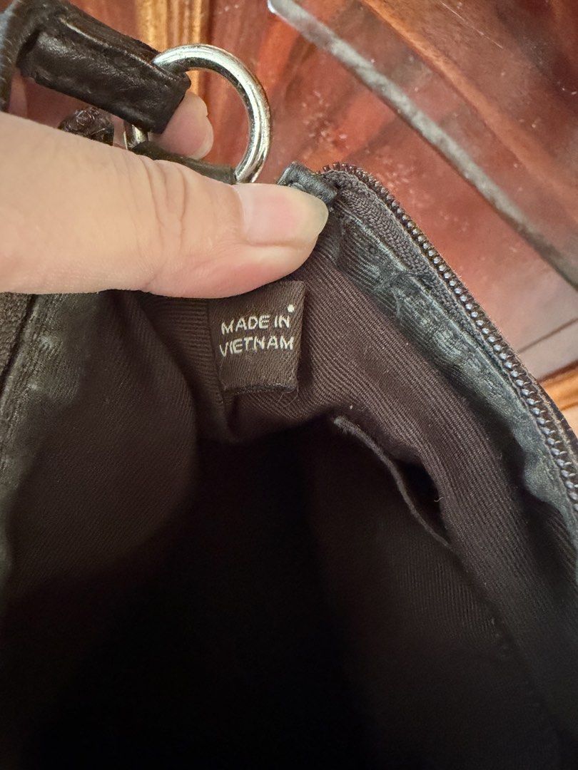 Coach Monogram Shoulder Bag (Category: Luxury Bags & Wallets) located in Caloocan City. Submitted by tintin.wolf (Listing ID 1464381424, Image 3). Description: Classic Coach monogram shoulder bag in brown and tan canvas with leather trim. Zipper closure, interior pocket. Compact size, perfect for essentials..