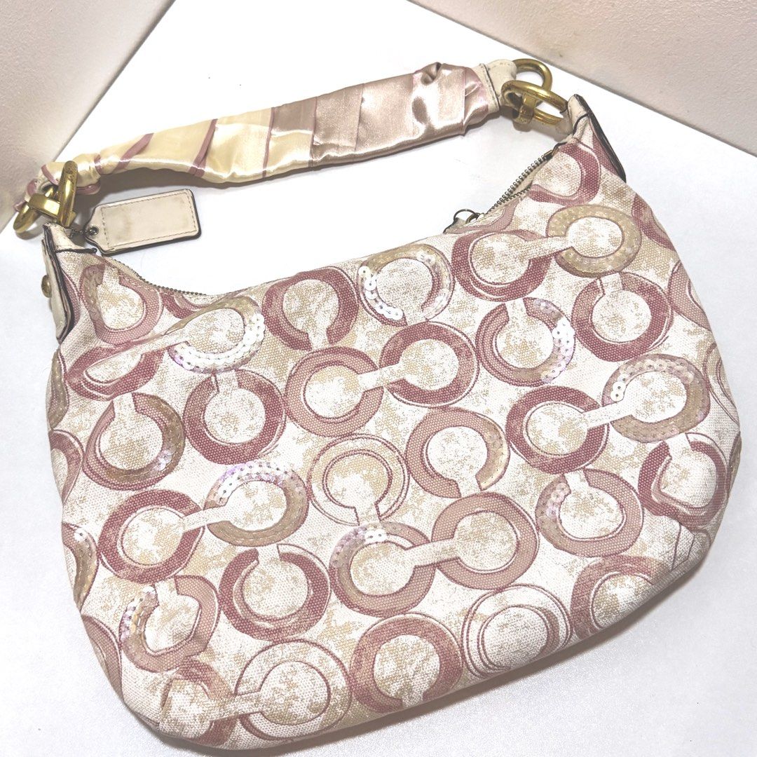 Coach Pink (fits IPAD) (Category: Shoulder Bags) located in Binan City. Submitted by marumarumart (Listing ID 1464393851, Image 3). Description: - can layaway for 2-3 weeks! with dp - bag canvas is in good condition - issue: repainted strap, discoloration sa strap (free silk wrap to cover sa straps) Free shipping fee ♥️ - fits ipad, umbrella, pouch, other stuffs pa! pwede for school - mod: lalamove JNT - loc: binan laguna.