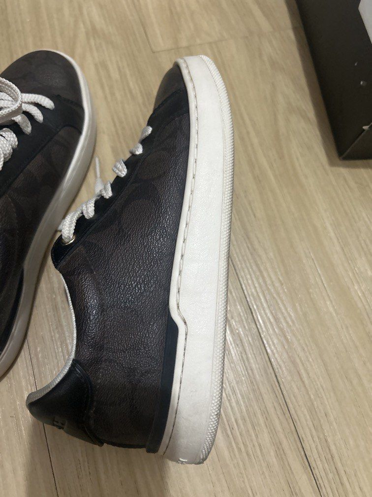 Coach Signature Canvas Sneakers (Category: Sneakers) located in Baguio. Submitted by trina_household (Listing ID 1464515671, Image 1). Description: - Authentic Coach sneakers - Signature C print - Color: Dark brown and black - White soles and laces - Classic low-top style - Ideal for casual wear - Bought in the US .