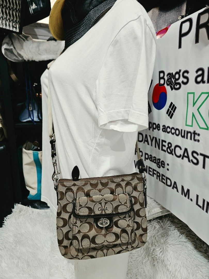 Coach Signature Monogram crossbody Bag (Category: Luxury Bags & Wallets) located in Cavite. Submitted by liveriver_514fd1 (Listing ID 1464398457, Image 1). Description: - Authentic Coach Crossbody - Signature monogram print (brown/tan) - Front flap pocket with turn-lock closure - Zippered main compartment - Detachable strap included - Ideal for carrying essentials.