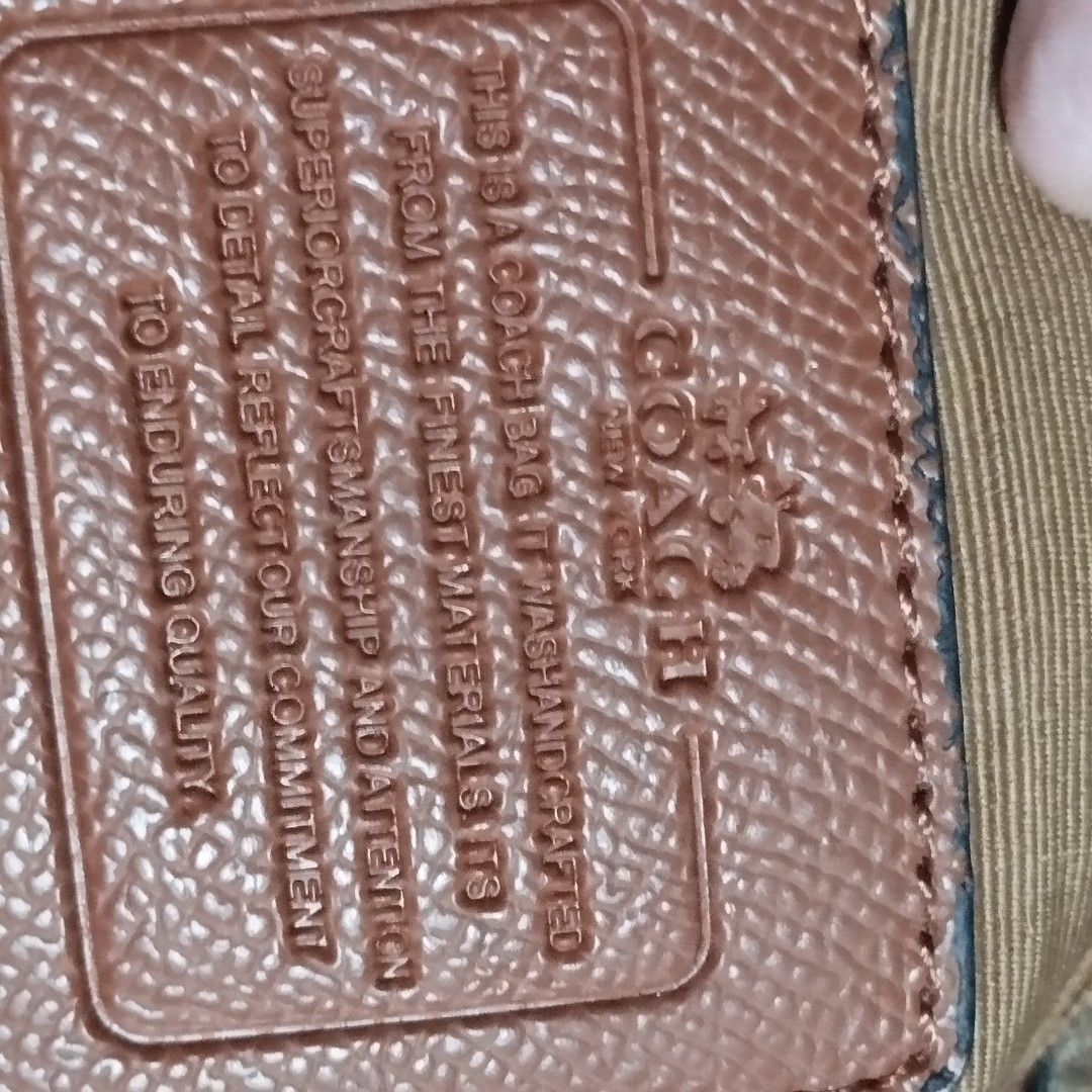 Coach Signature Tote Bag (Category: Tote Bags) located in Manila. Submitted by lene48 (Listing ID 1464487426, Image 3). Description: - Classic Coach tote bag - Signature C pattern all over - Brown and tan colorway - Genuine leather trim and handles - Secure zipper closure - Interior features a zippered pocket and slip pockets - Ideal for everyday use.