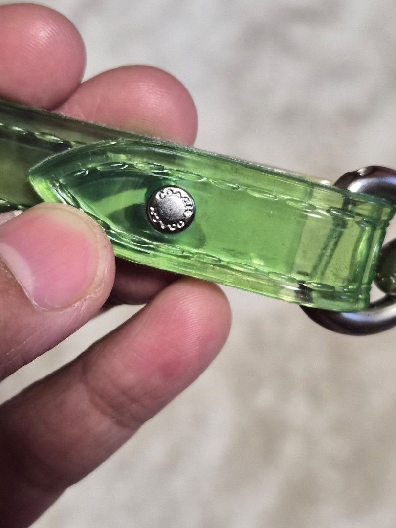 Coach Translucent Green Keychain Strap (Category: Luxury Accessories) located in Mandaue City. Submitted by chuchi152615 (Listing ID 1464403181, Image 3). Description: - Coach keychain strap - Translucent green color - Silver hardware with Coach logo - Versatile: Attaches to bags or keys - Adds a pop of color - Clean and simple design.