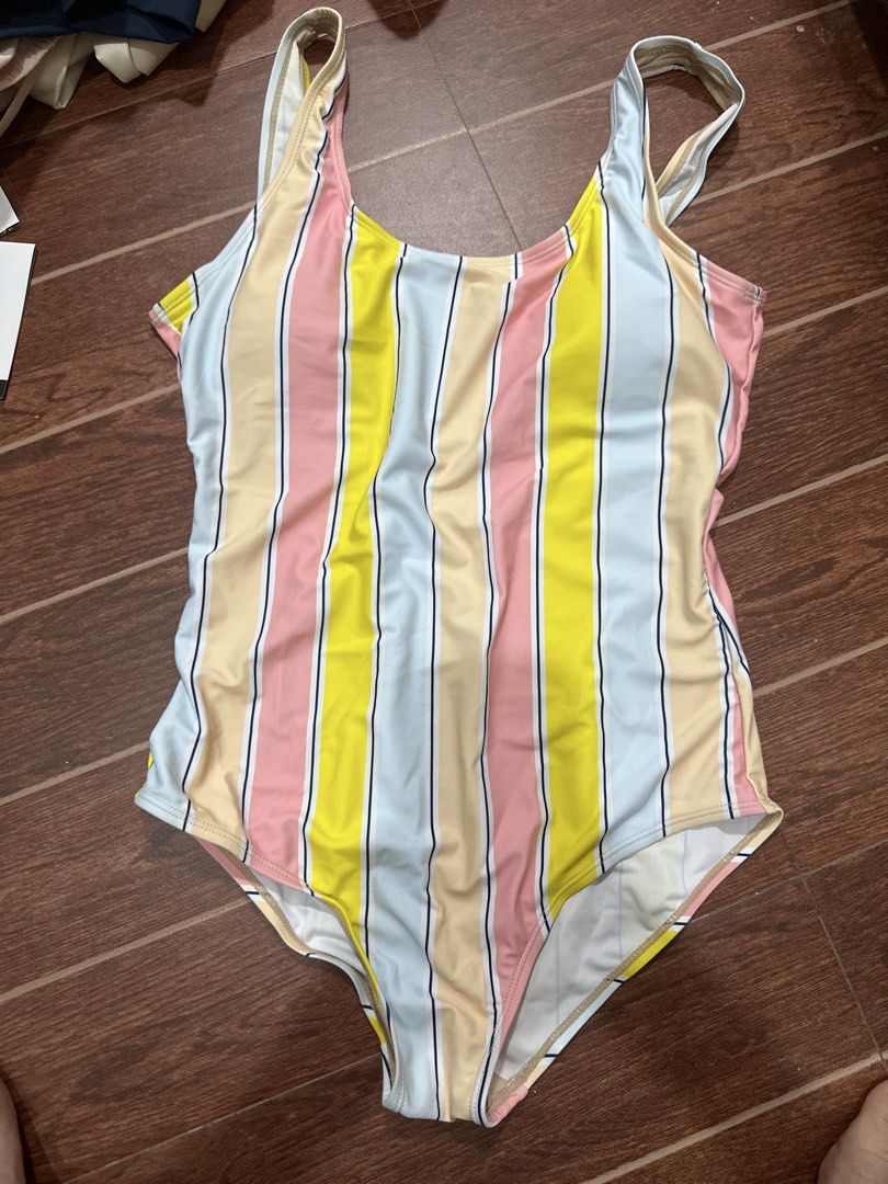 Coco Cabana Striped One-Piece Swimsuit Size L (Category: Bikinis & Swimsuits) located in Marikina City. Submitted by rctoby00 (Listing ID 1464444489, Image 1). Description: - Cute one-piece swimsuit from Coco Cabana - Size: Large (L) - Design: Colorful vertical stripe pattern - Material: Polyester and spandex blend - Perfect for: Beach or pool.
