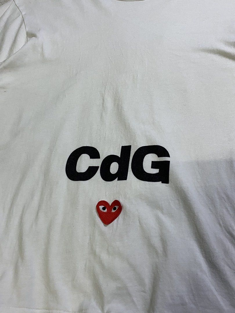Comme des Garcons (play) (Category: Tshirts & Polo Shirts ) located in Cavite. Submitted by nld_thrift (Listing ID 1464361523, Image 2). Description: Comme des Garcons (play) W: 21Inc L: 27.5 Inc XL ON TAG Made In JAPAN 100% Cotton No refund/ no return, ask before buy, all sales are final. IF YOU ARE IN DOUBT ABOUT ANY DETAILS OF THE ITEM YOU’RE PURCHASING PLEASE FEEL FREE TO CONTACT US .