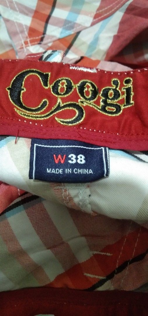 Coogi Plaid Cargo Shorts Size W38 (Category: Shorts) located in Quezon City. Submitted by aljonbermu25659 (Listing ID 1464360833, Image 2). Description: - Brand: Coogi - Style: Cargo Shorts - Color: Red, White, and Blue Plaid - Material: 100% Cotton - Features: Multiple pockets with button closures - Ideal for: Casual wear.