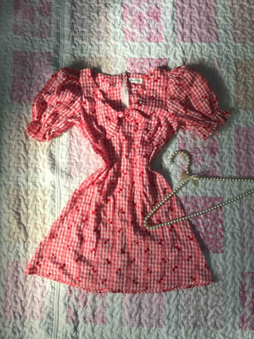 Coquette🍒 Gingham Cherry Puff Sleeve Dress (Category: Dresses) located in Iligan City. Submitted by thepinkconsole.ph (Listing ID 1464567781, Image 1). Description: - Super cute pink gingham dress - Adorable cherry print - Features puff sleeves - Sweet tie detail at the neckline - Comfortable textured fabric - Ideal for picnics or casual days out - Guaranteed to look adorable!.