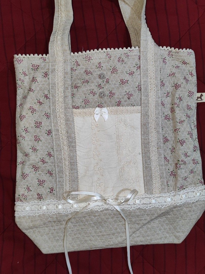 Coquette tote bag (Category: Tote Bags) located in Iloilo. Submitted by cynehllevie (Listing ID 1464367620, Image 2). Description: 🍥 lowered price (much cheaper now than before) 🍥 really pretty in personal! 🍥 Length: 13.5 inch 🍥 Width: 12.5 inch note: measurement may slightly be a bit different.