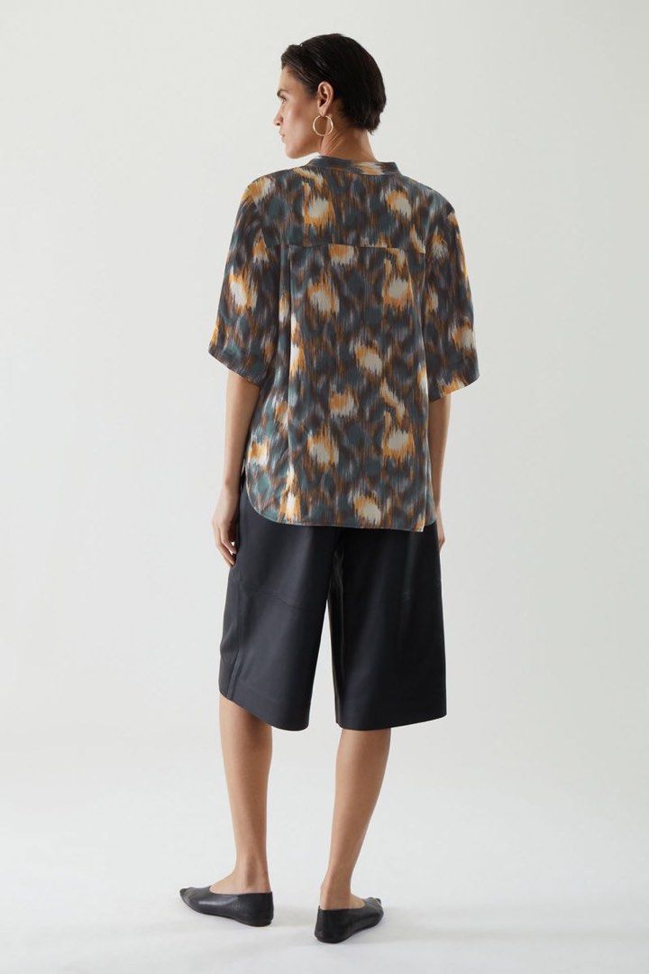 COS BRAND SHORT SLEEVE (Category: Blouses) located in Santa Rosa. Submitted by eceldg05 (Listing ID 1464407219, Image 2). Description: COS BRAND SHORT SLEEVE TOP BUTTON DOWN MED/large fit Flowy satin fabric Like new.