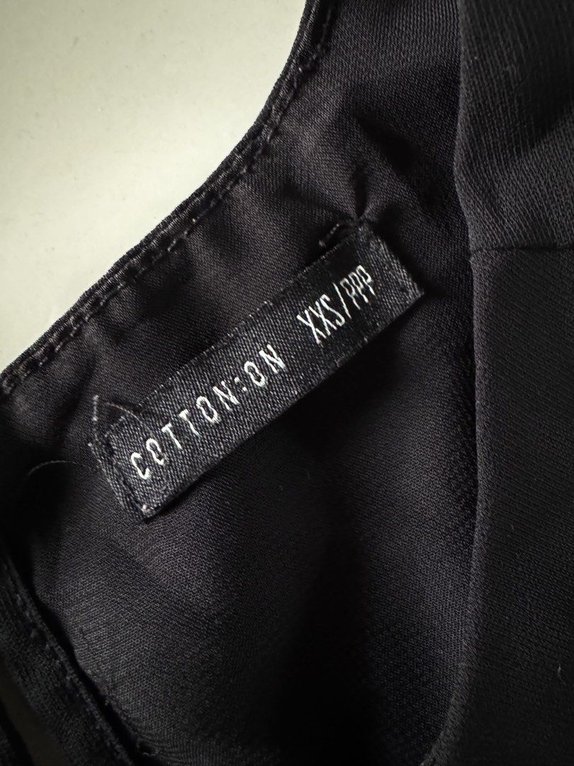 Cotton On Black Sleeveless Top (Category: Sleeveless) located in Bulacan. Submitted by _arislmt (Listing ID 1464417939, Image 3). Description: - Brand: Cotton On - Type: Sleeveless Tank Top - Color: Black - Style: Simple and classic - Versatility: Perfect for layering or wearing on its own - Pairing: Easily matches with any outfit - Fits XS.