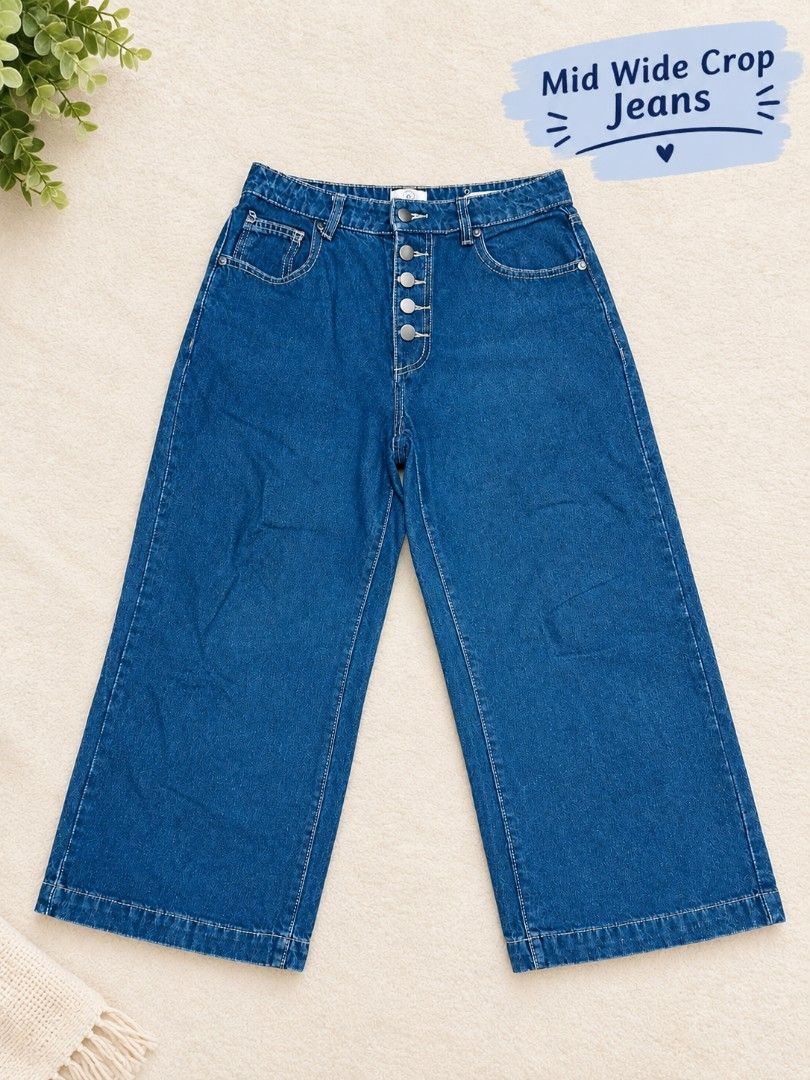 Cotton On (Mid Wide Crop Jeans) (Category: Jeans) located in Manila. Submitted by dizonnixni94357 (Listing ID 1464402238, Image 1). Description: - Trendy wide-leg cropped jeans in classic blue denim. - Comfortable mid-rise waist with secure button-up front. - Features the classic five-pocket design for practicality. - Effortlessly stylish for a casual everyday look..