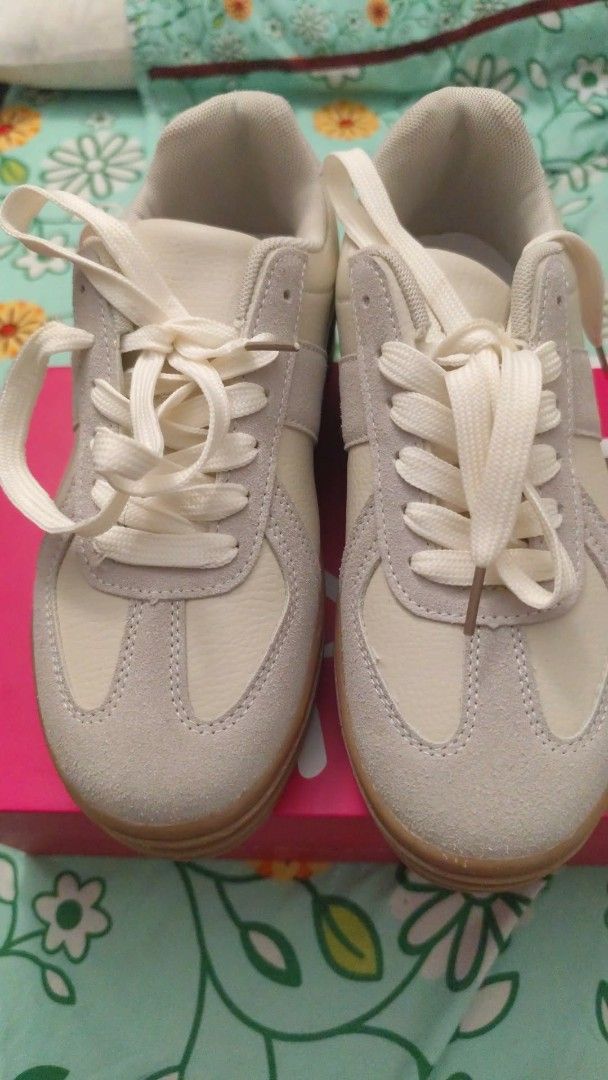 Cream & Pink Suede Sneakers (Category: Sneakers) located in Manila. Submitted by marriage031073advocate (Listing ID 1464408596, Image 1). Description: - Cream and grey colorway - Suede and leather accents - Classic lace-up closure - Durable gum sole - Comfortable for all-day wear - Stylish design - Estimated size: 7 or 8 (please check measurements).
